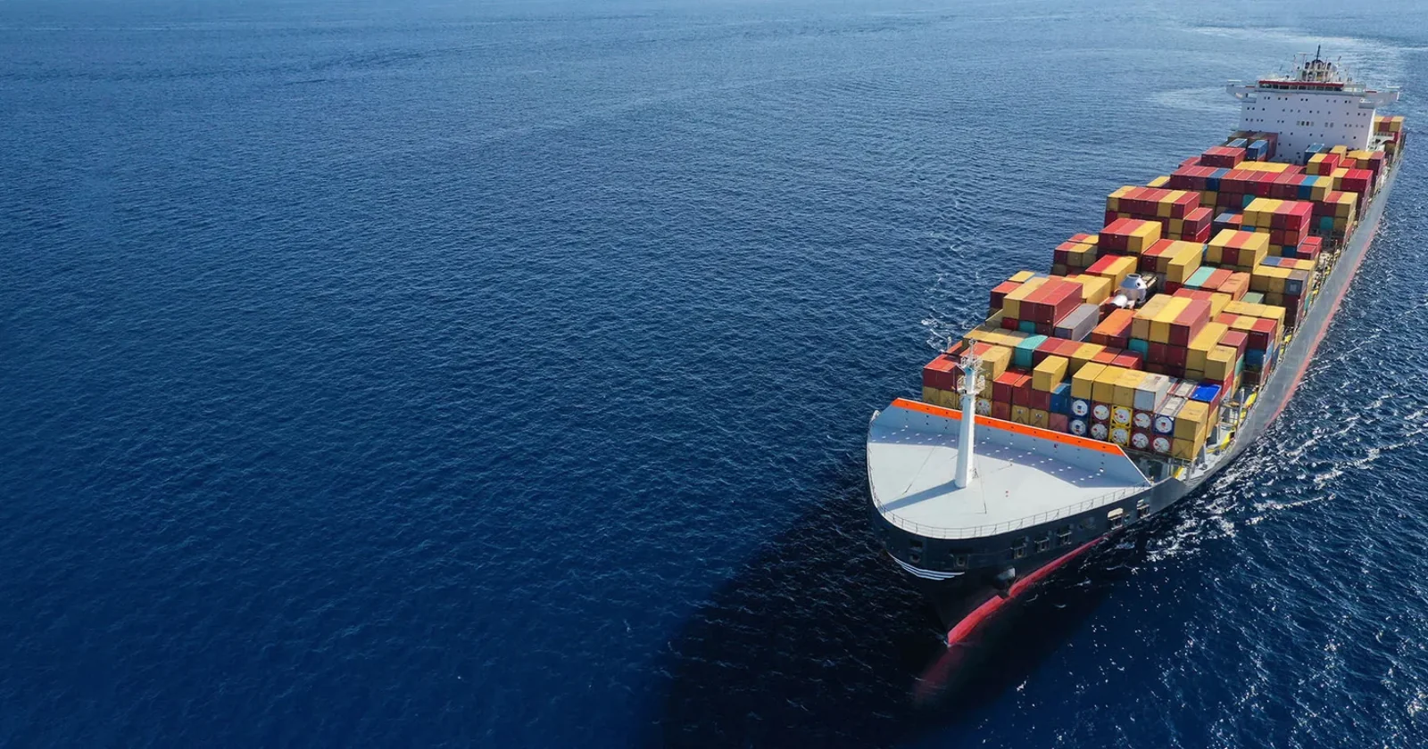 Aerial view of a laden container ship under way at sea