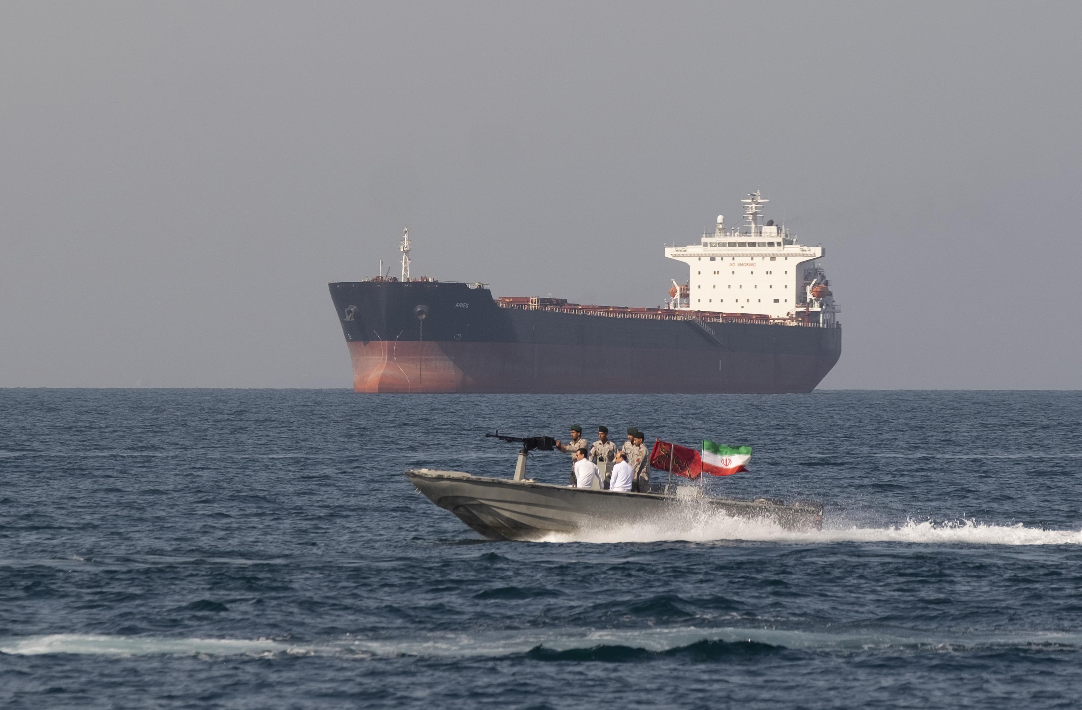 Iranian patrol craft operating near merchant shipping in the Strait of Hormuz